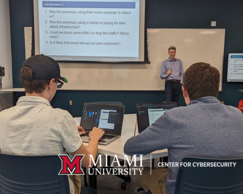 Cybersecurity students engage with a featured expert in the Cybersecurity Lab.