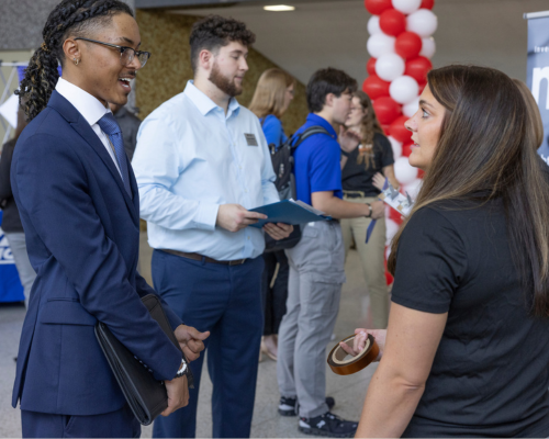 CEC student speaks with recruiter at STEM Career Fair