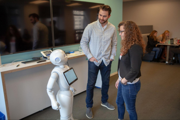 Miami students interact with a Pepper robot, purchased through RAPIDS 2 grant funding.