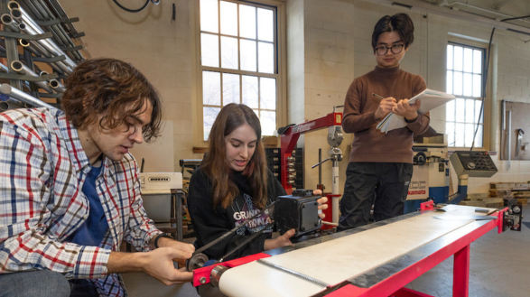 Two mechanical engineering students work on a project in the machine shop in Oxford, Ohio