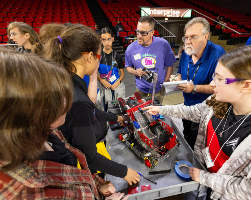 Middle school students discuss their robot at Millett Hall
