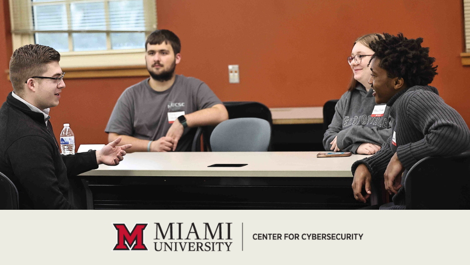 Students speak with cybersecurity professionals at the speed networking event