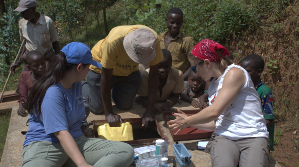 Two female CEC students from Oxford, Ohio work with local professional engineers and community members to install a water rehabilitation system in the Rugendabari sector of Rwanda.