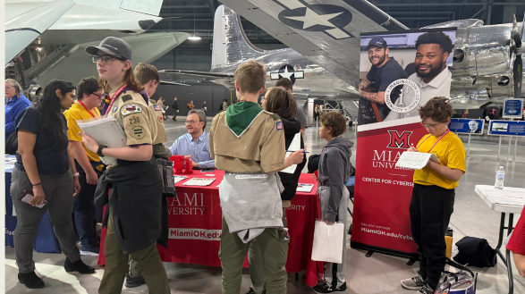 Director of Miami University Center for Cybersecurity James Walden engages with scouts at the Cybersecurity Merit Badge event at the US Air Force Museum in Dayton, Ohio.