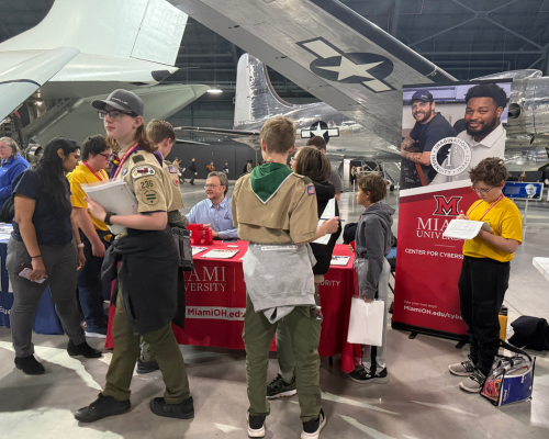 Director of Miami University Center for Cybersecurity  James Walden engages with scouts at the Cybersecurity Merit Badge event at the US Air Force Museum in Dayton, Ohio.