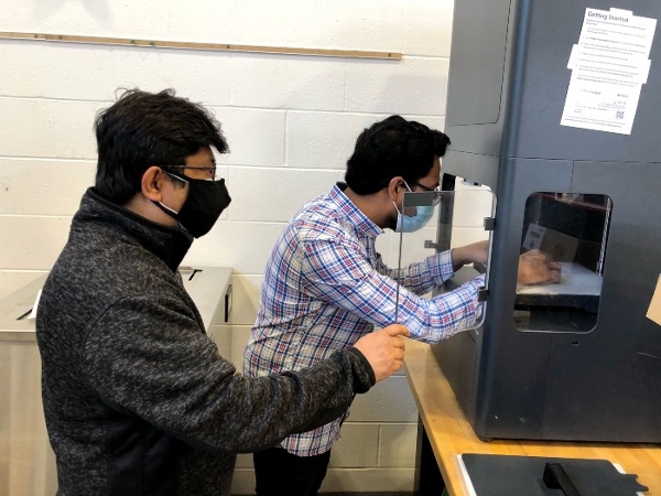 Dr. Jahan working with a student in a MME lab.