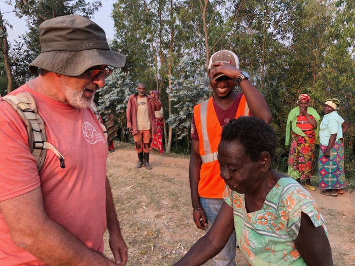 Chuck Dragga in Rwanda talking with some of the locals.