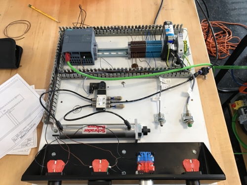 Robotic parts built on table above view.