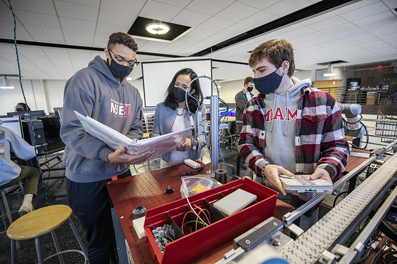 Beena Sukumaran with students in the classroom.