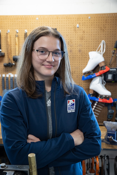 Maddie Weaver '24, Mechanical Engineering major, stands in front of tools in Miami's Mechanical Engineering High Bay lab.