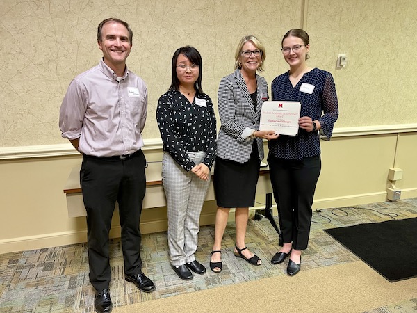 Maddie Weaver receives her award from Miami University Provost Liz Mullenix