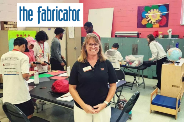 Joanna Hohn, director of CEC K-12 Outreach, stands in a camp classroom environment. Image courtesy of Gareth Sleger, The Fabricator