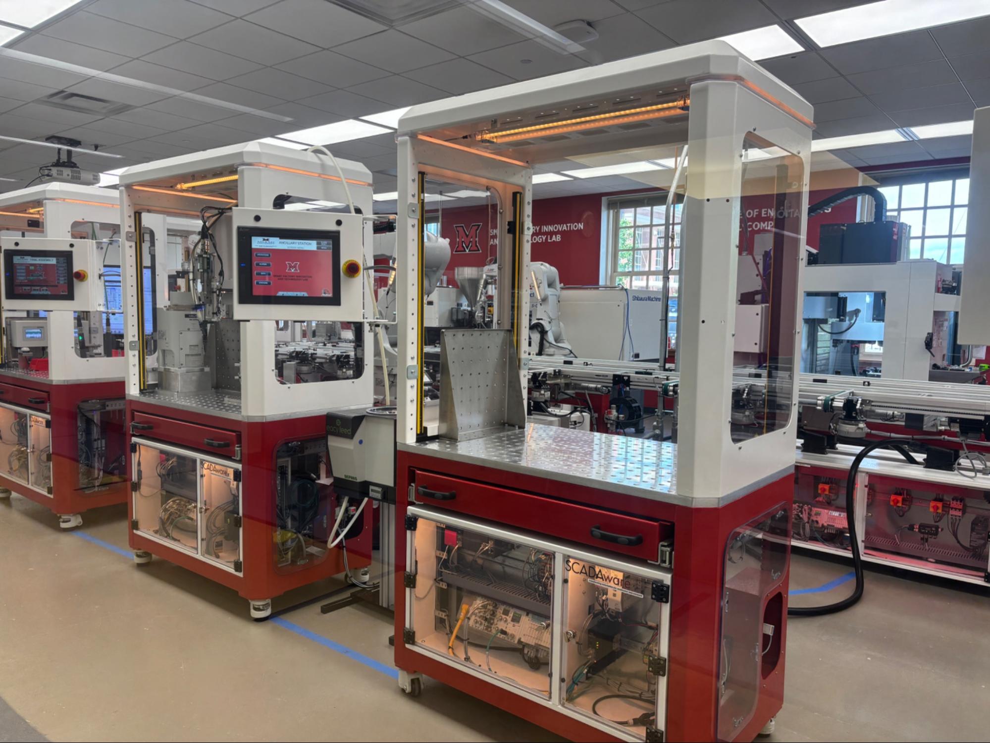 Close up of red and white robotic equipment in the Smart FIT lab
