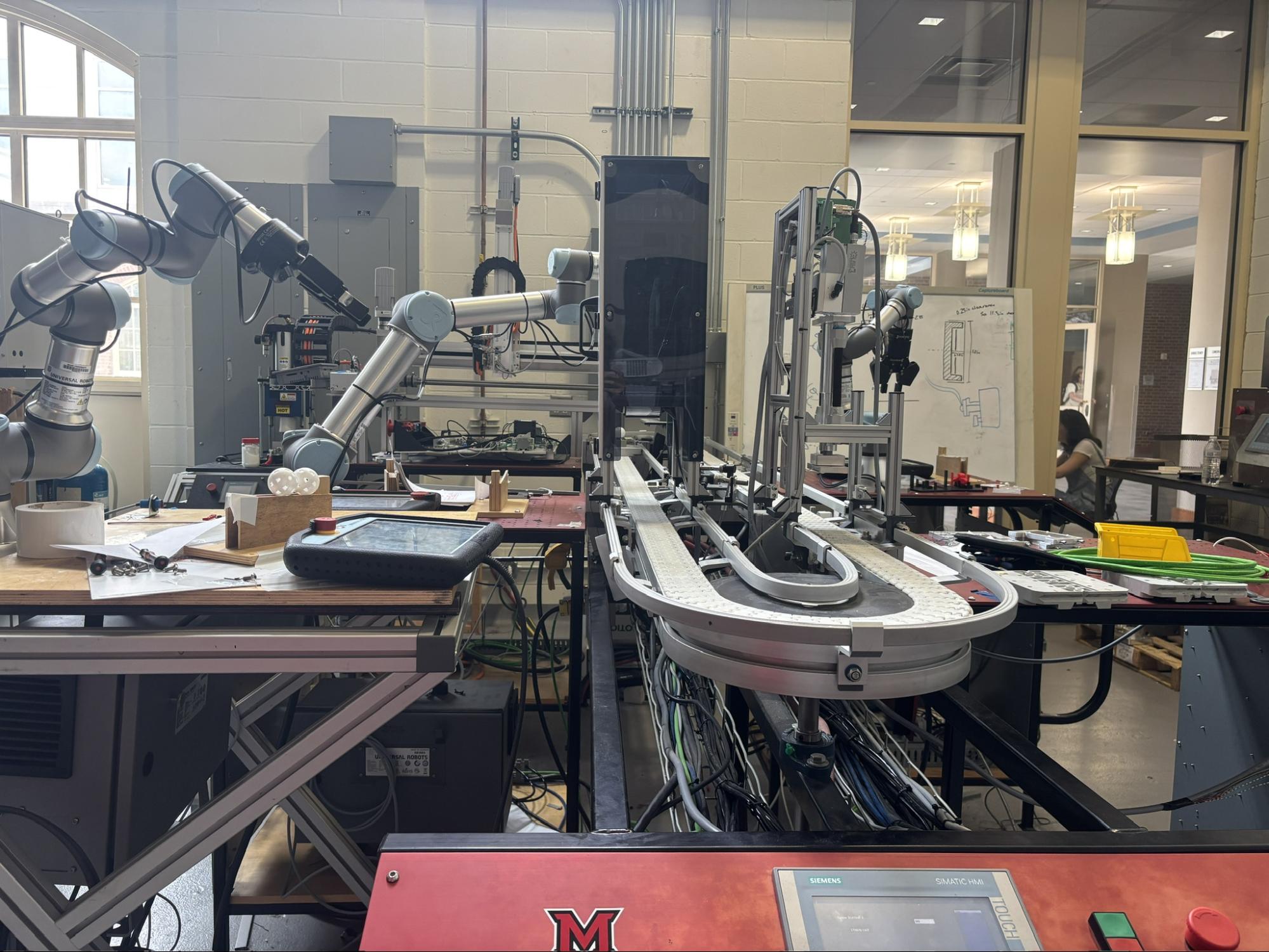 Small scale manufacturing equipment with conveyor belt for student use