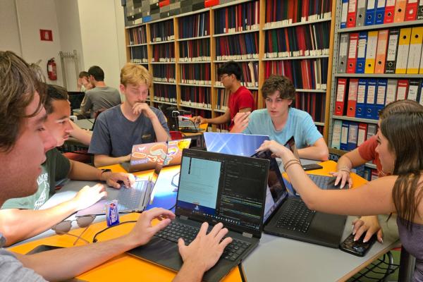 CEC students work on a group project on AI knowledge representation in a classroom at University of Calabria.
