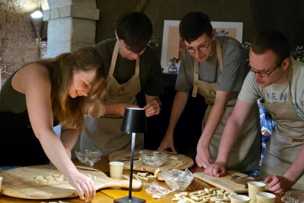 CEC students roll out dough for a pasta making class.