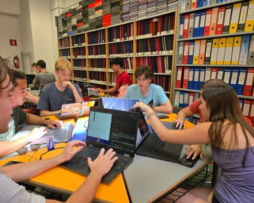 CEC students work on a group project on AI knowledge representation in a classroom at University of Calabria.