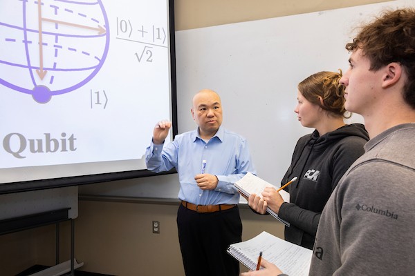 Liran Ma teaching in a classroom