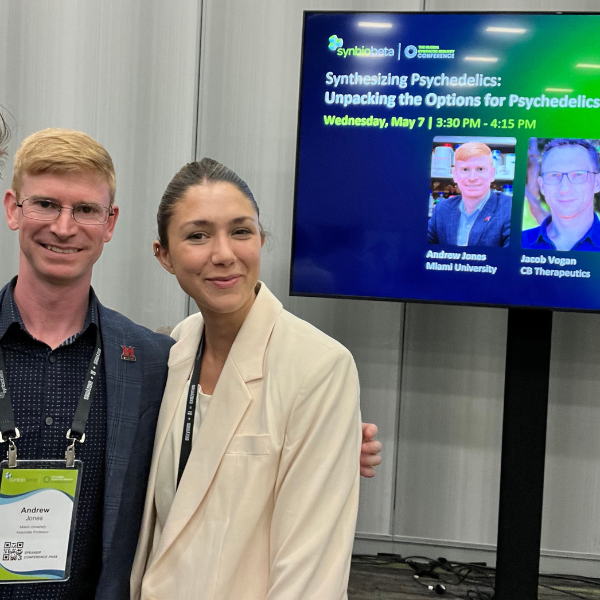 Andrew Jones stands with EYWA Biotech CEO Victoria Costa Paz at conference