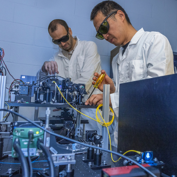 Thibault Bondaz, Ph.D. (left) works with Hui Wang, Ph.D. in Wang's research lab.
