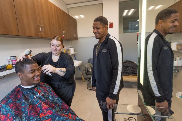 a person getting a haircut