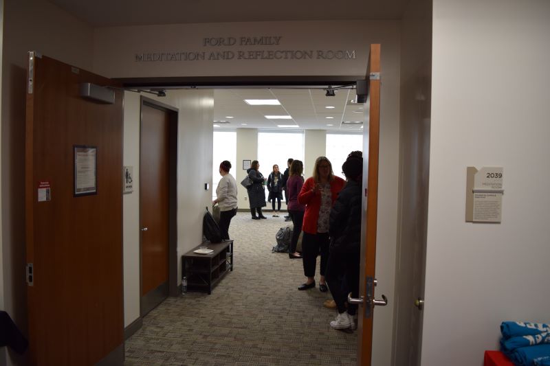 people talking inside of an empty room