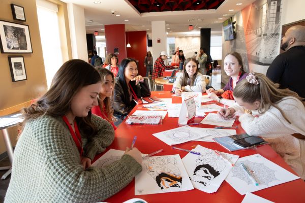 Students coloring images of Swoop