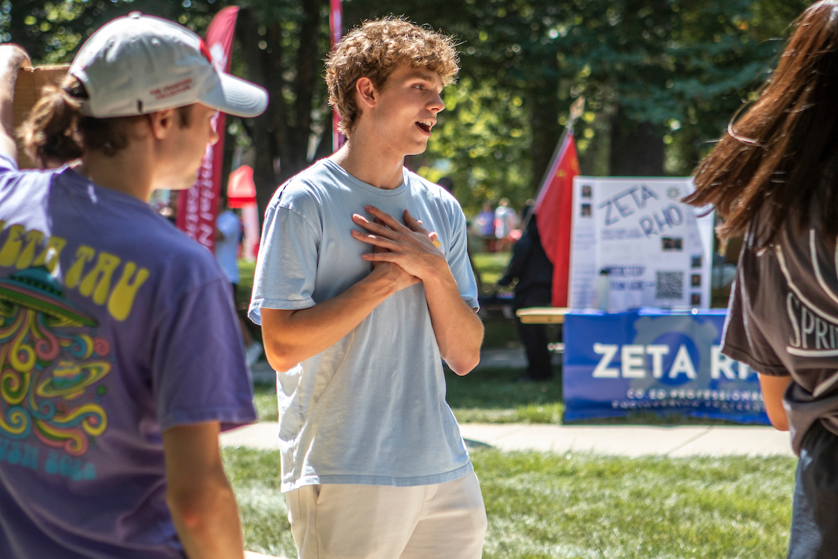 two students talking outside