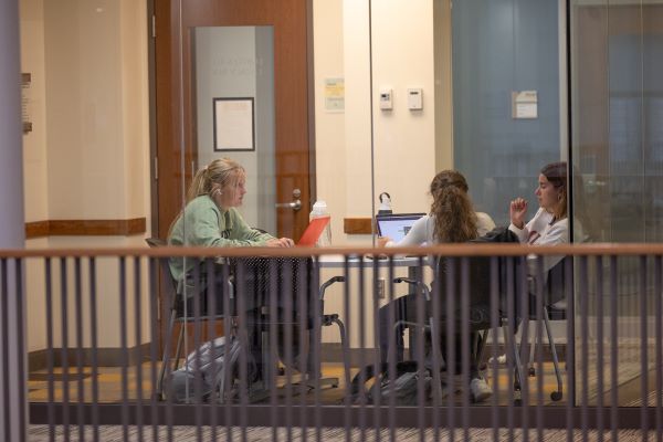 A small group of students on laptops in an Armstrong Study Room