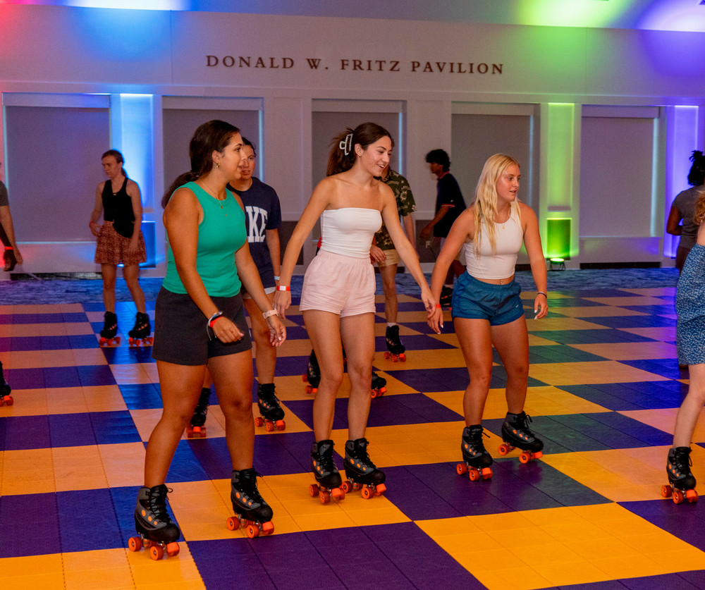 students roller skating on a hard floor in the fritz pavilion