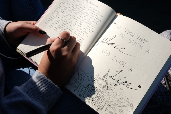 a student writing in their journal