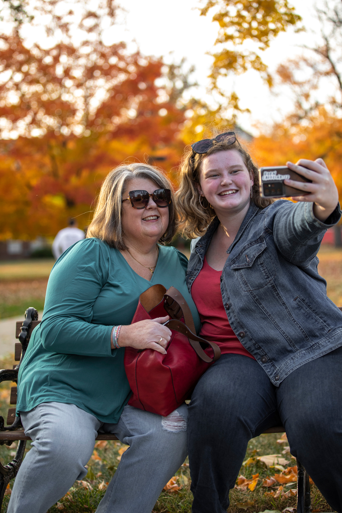 A parent and student pose for a selfie together.