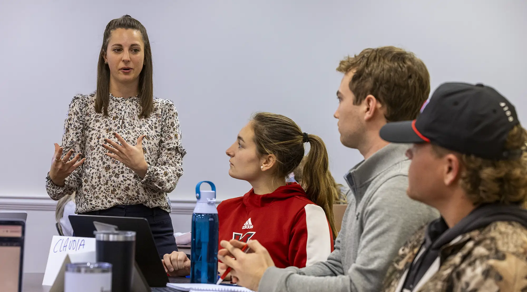 An instructor teaching a Management class
