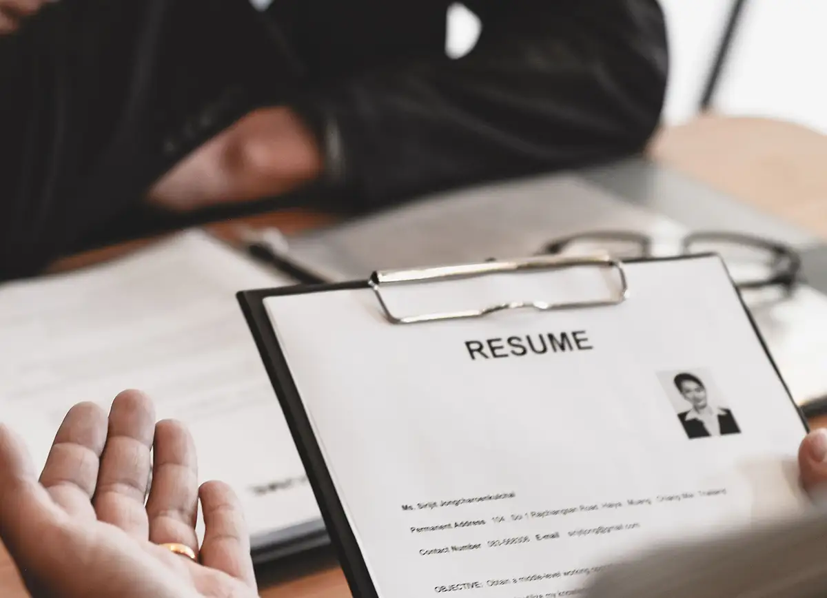 hands holding a resume