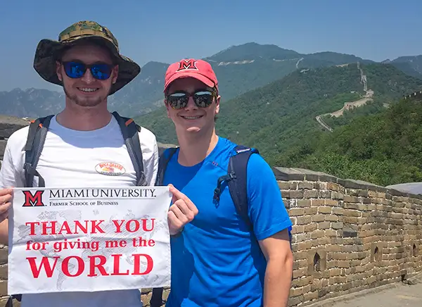 students studying abroad in front of a mountain vista