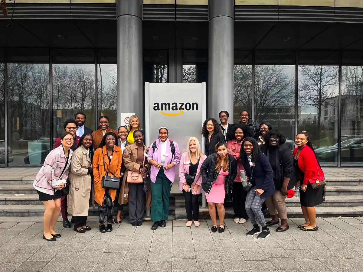 Miami students posing in front of the Amazon building