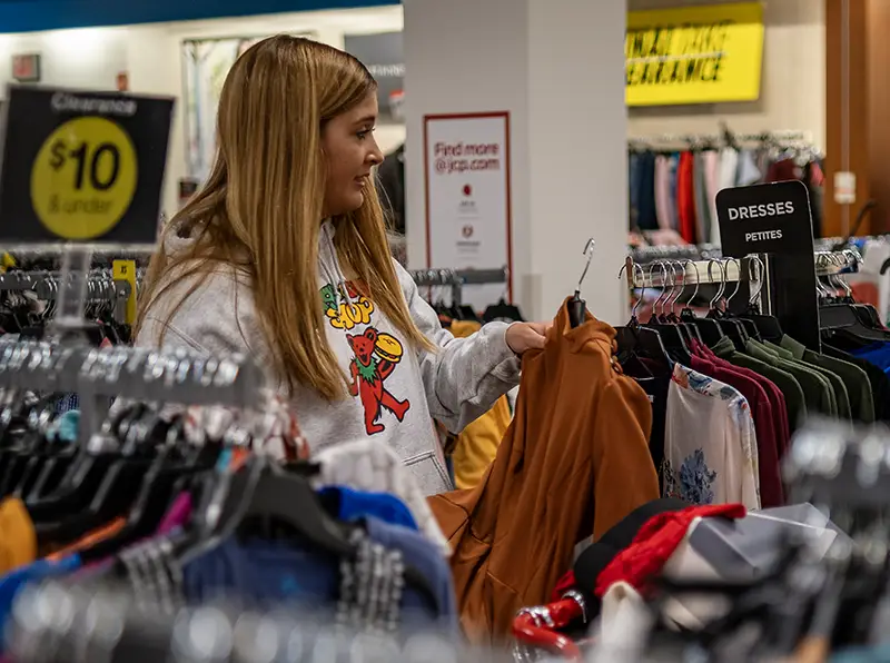 Miami student picking out professional attire at JCPenney
