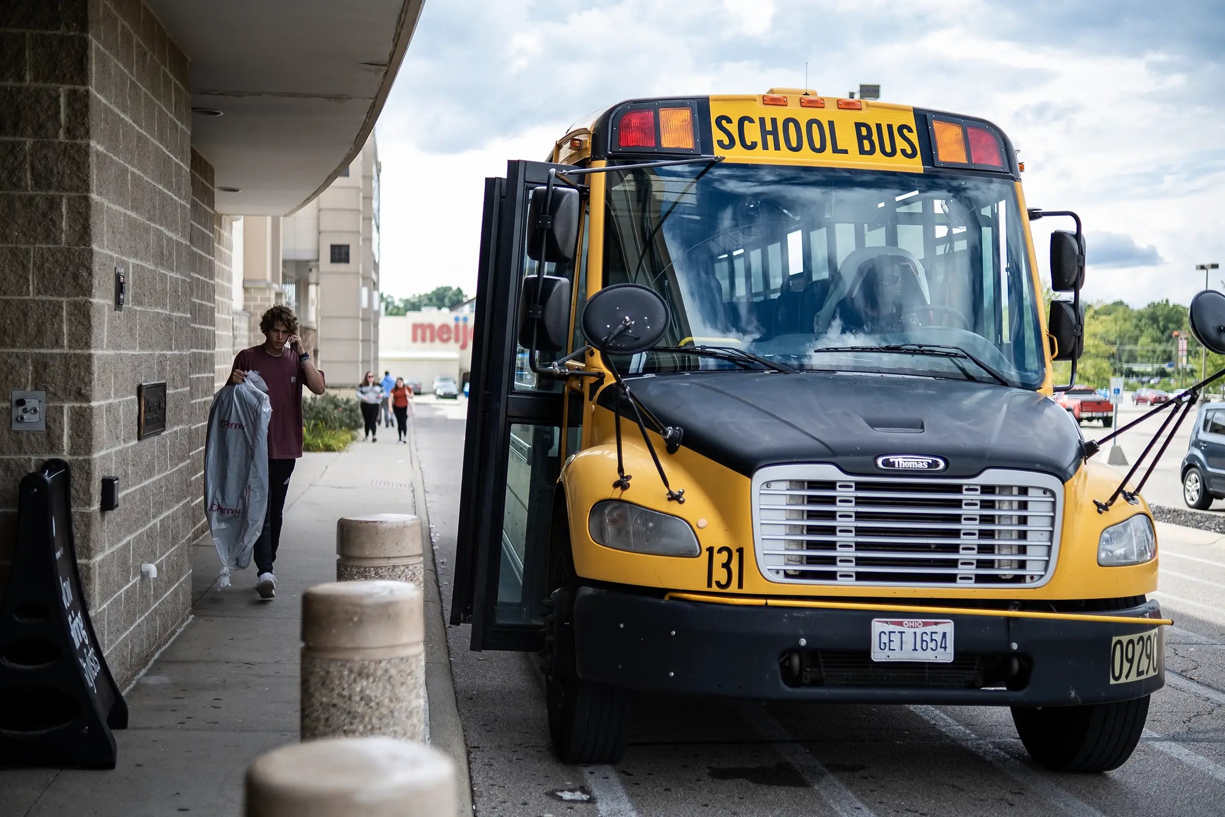 A Bus pulls into the JCPenney parking lot.