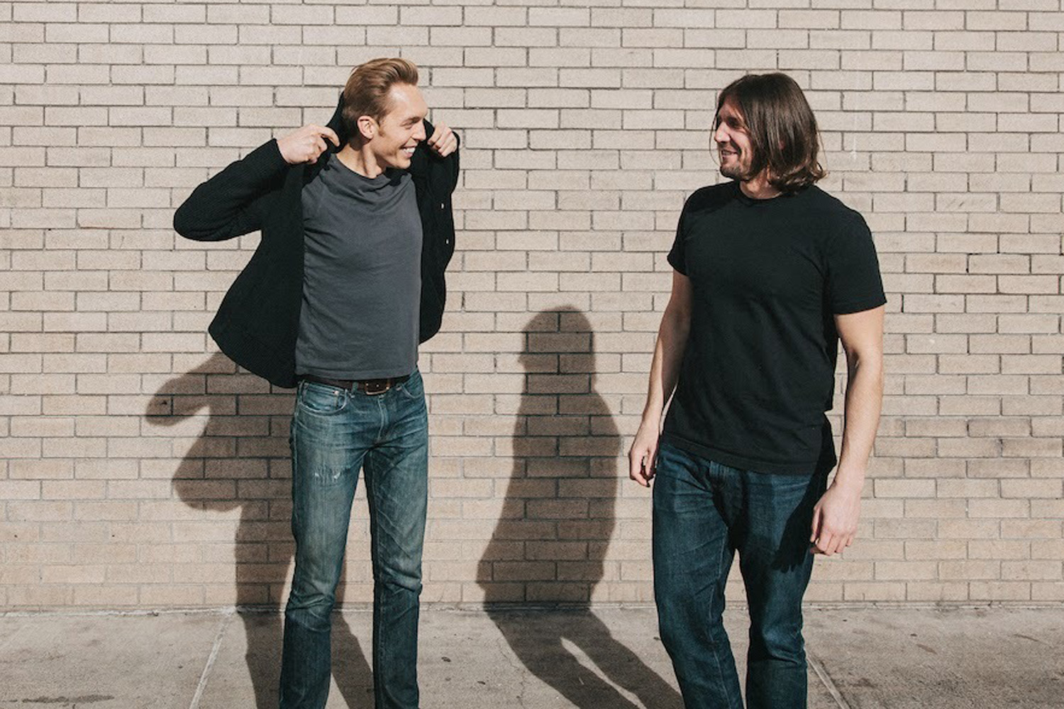 The Minimalists smile for a photo.