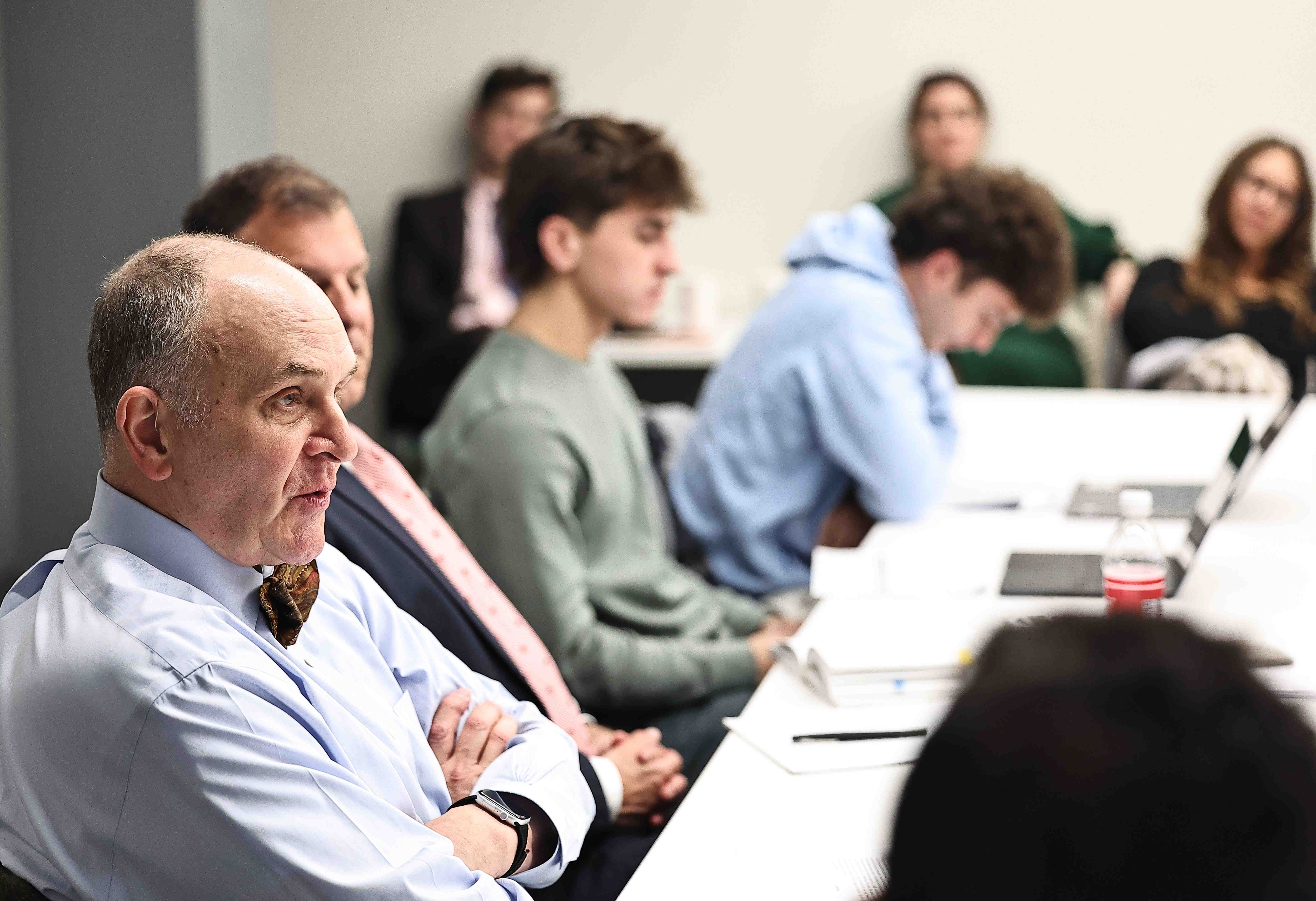 Eliot Cohen at table with students