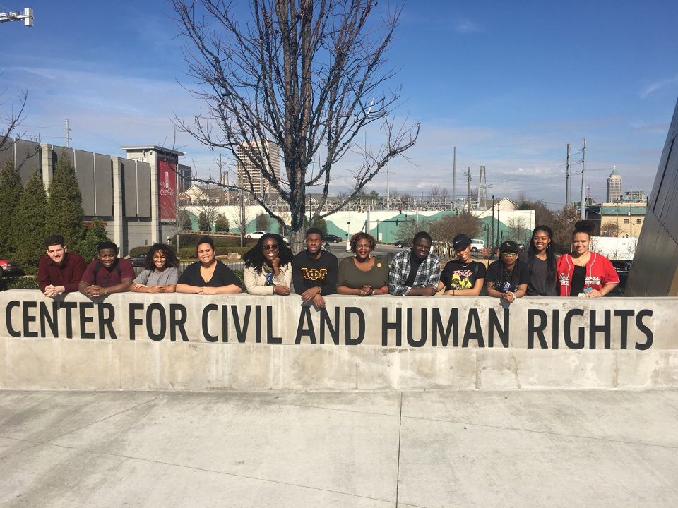 Group of about 15 Black students behind a sign that reads Center for Civil and Human Rights