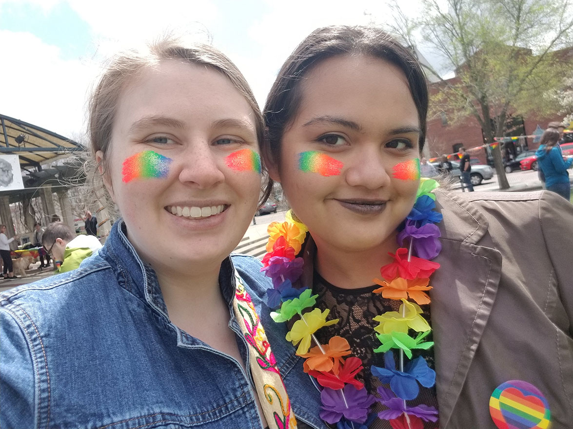 Two students with rainbow face paint.