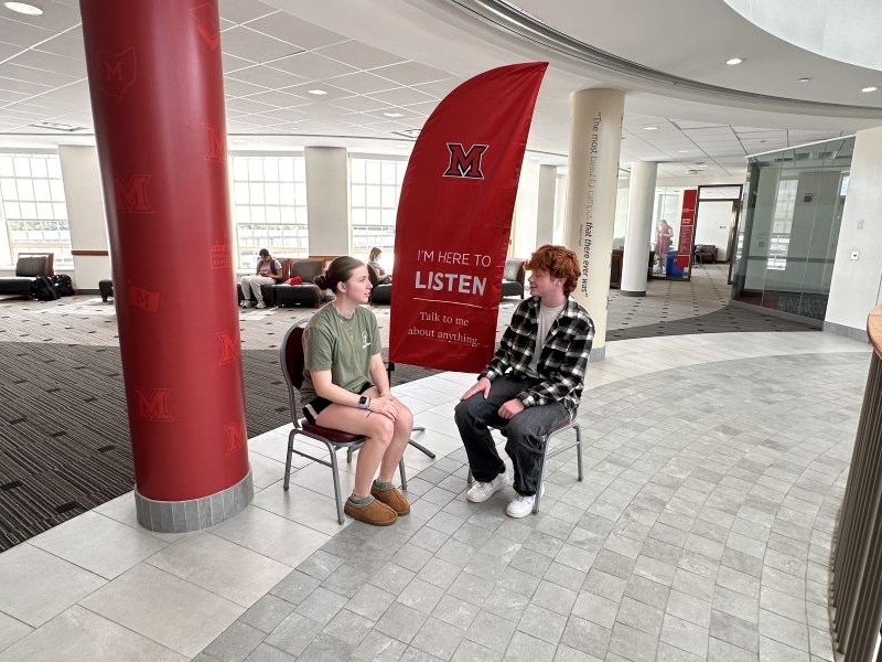 A student checking in at the Rinella Learning Center office.