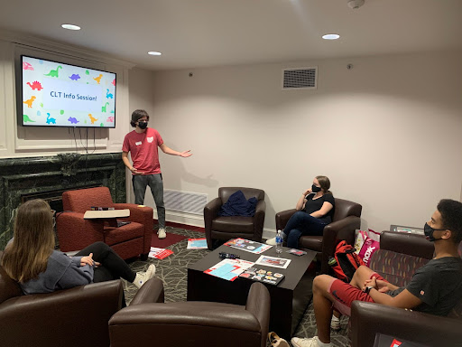 Casey Newton, an RA in Collins Hall, leads an information session about their Community Leadership Team.