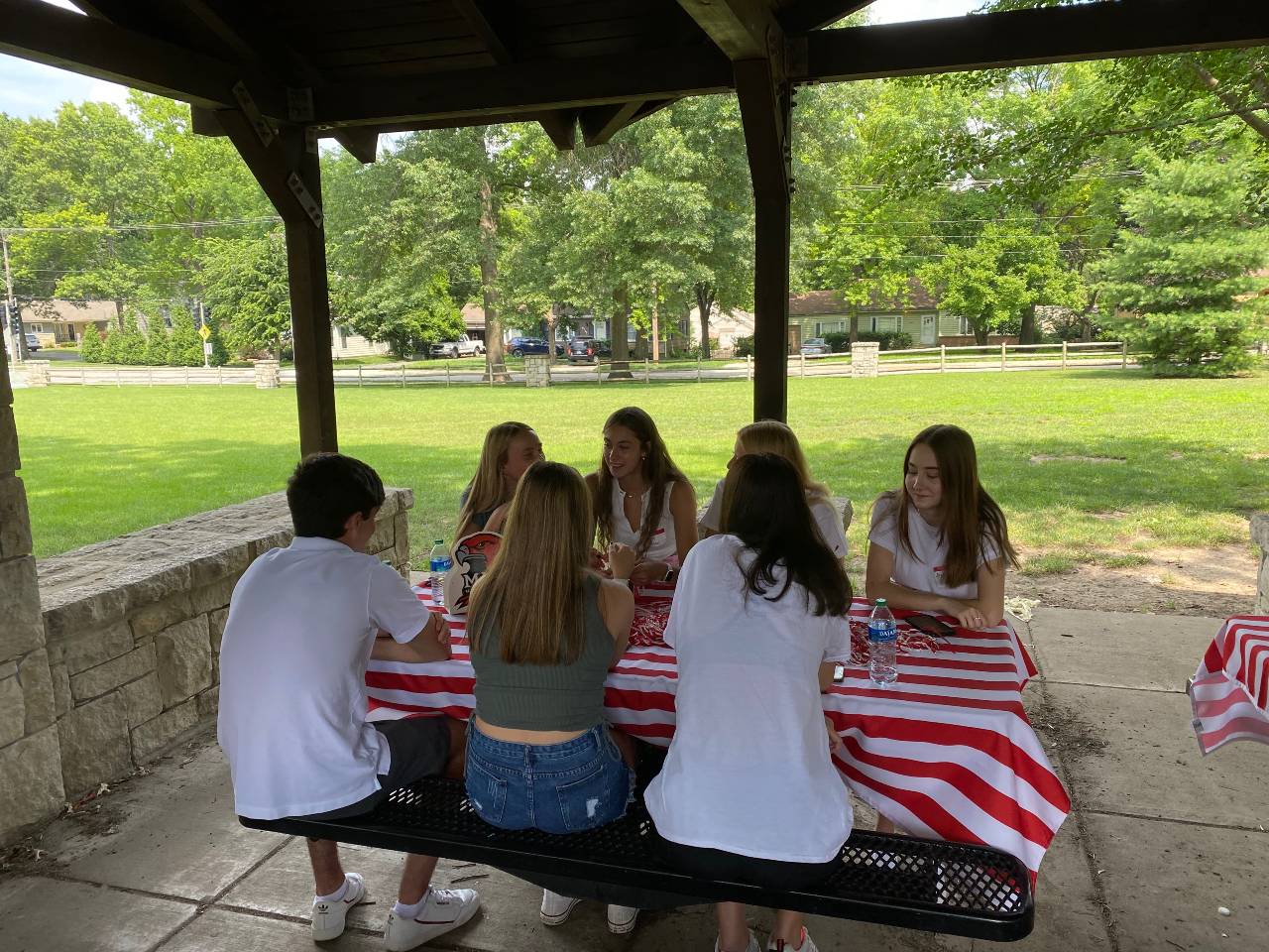 Group of incoming students sitting together at a new student send off in Kansas City