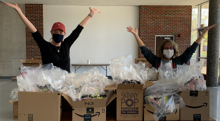 Susan Keiffer and Susan Osha behind completed care packages