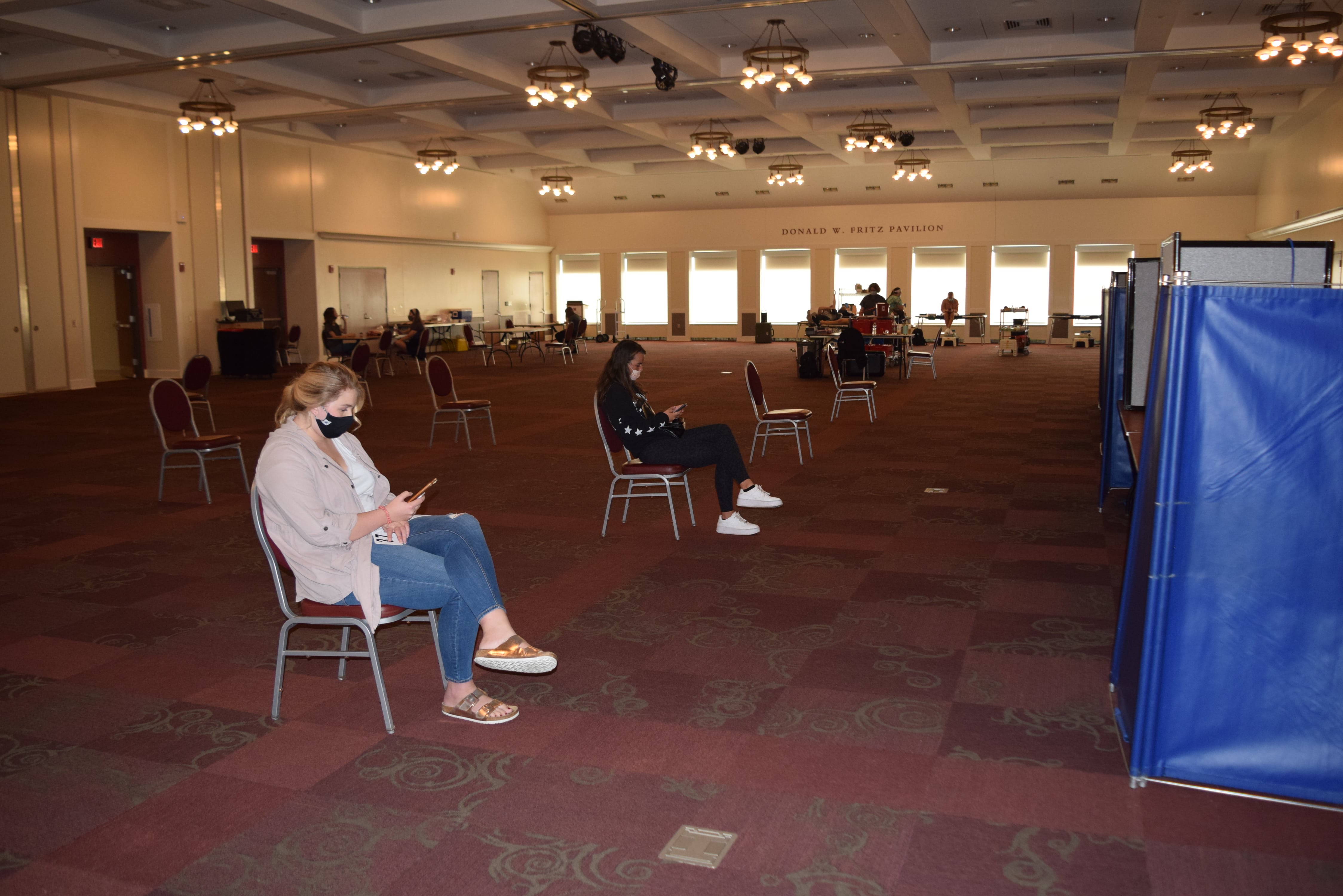 Armstrong Pavilion with students spaced out in chairs waiting to donate blood