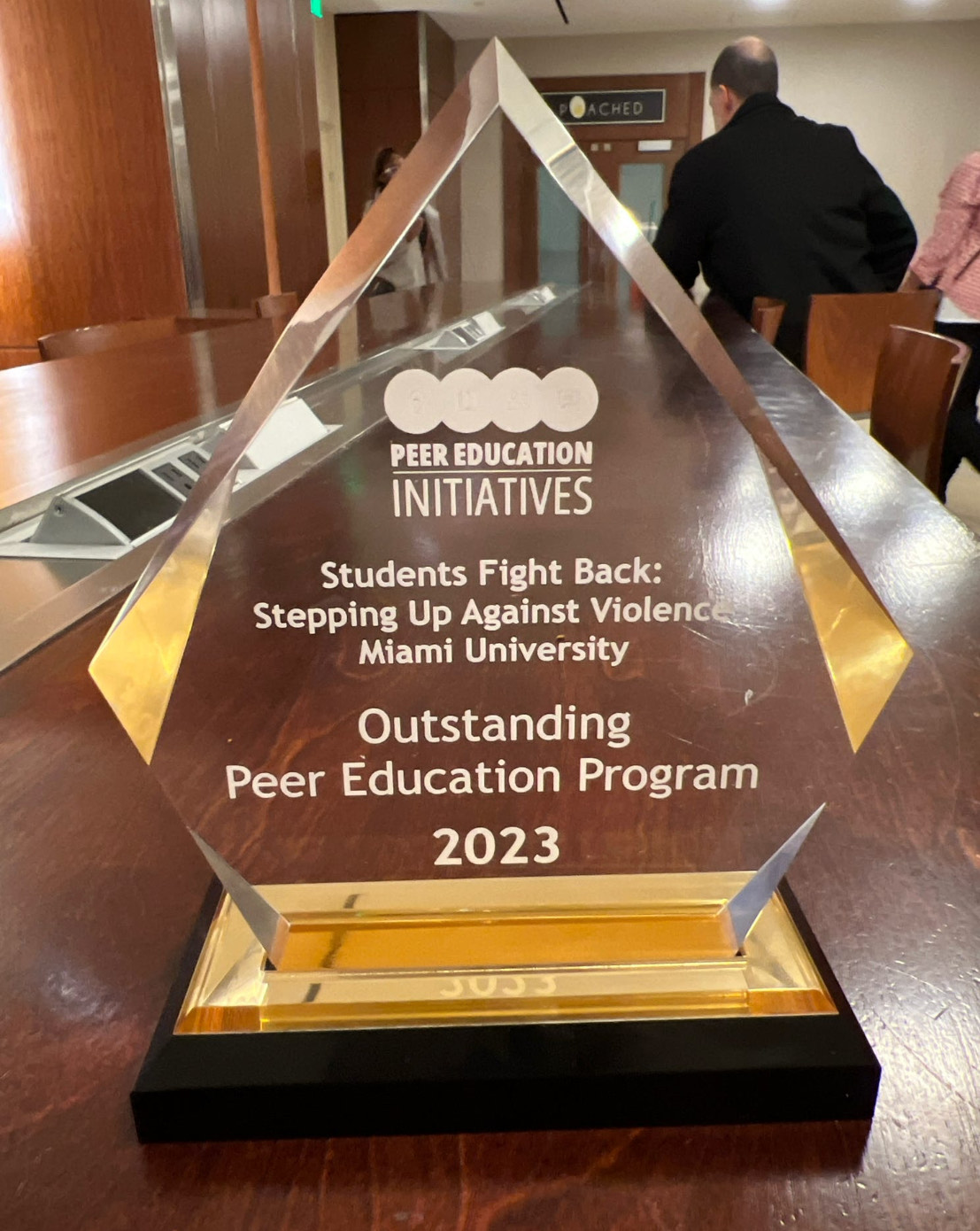 4 HAWKS peer health educators holding up the award in San Francisco.