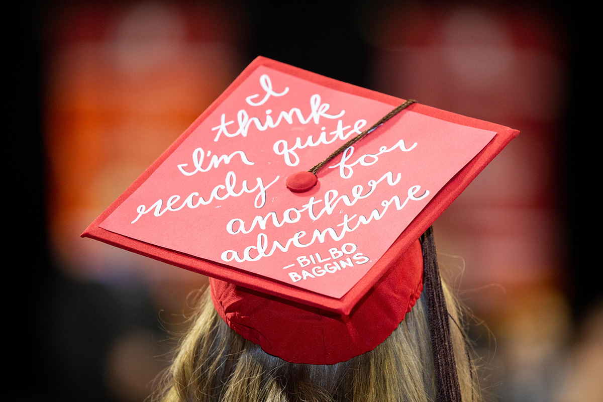 A graduation cap with "I think I'm quite ready for another adventure - Bilbo Baggins" written on it.