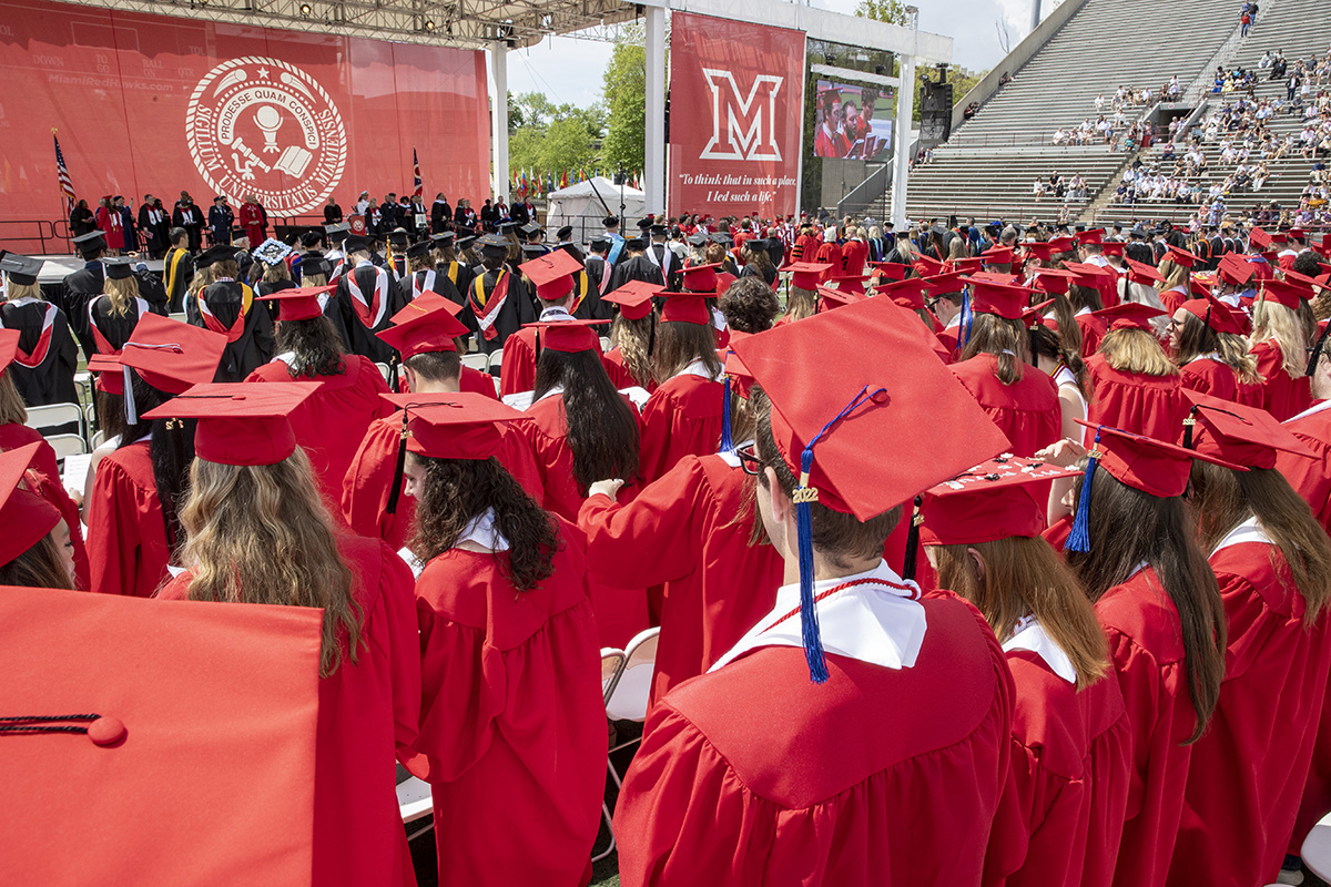 Graduates at a commencement ceremony in Yager Stadium.
